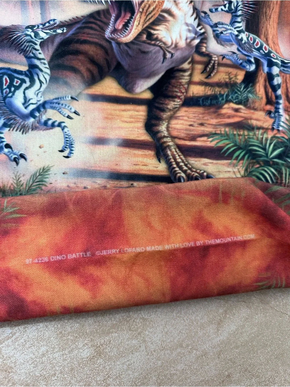 The Mountain Orange Dinosaur Messenger Bag with Black Straps